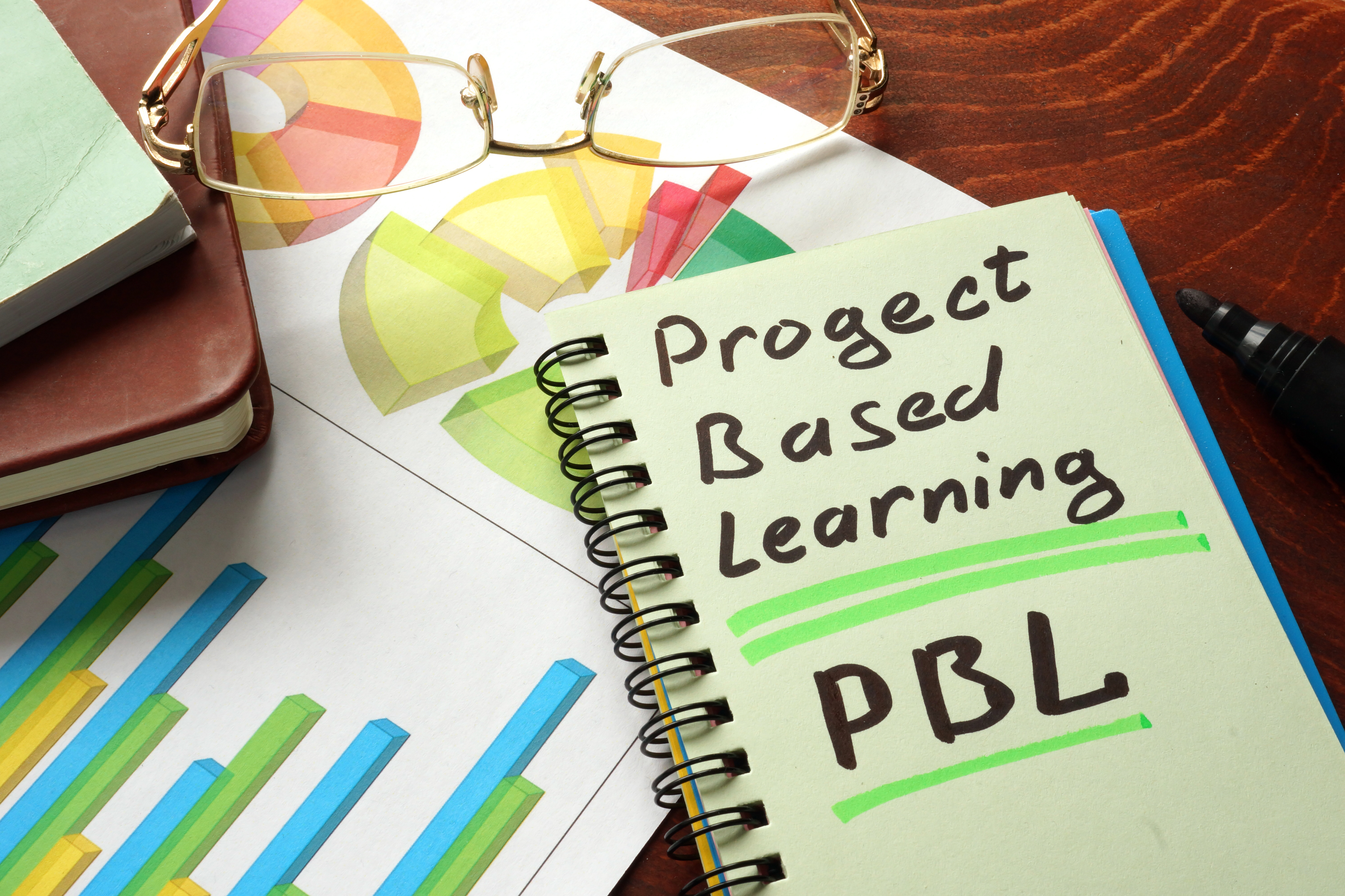 Notebook with project based learning PBL sign. ""