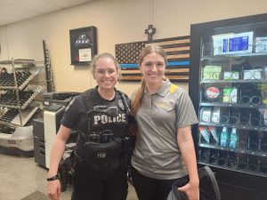 Maddie Buzza with a local Louisville Police Officer