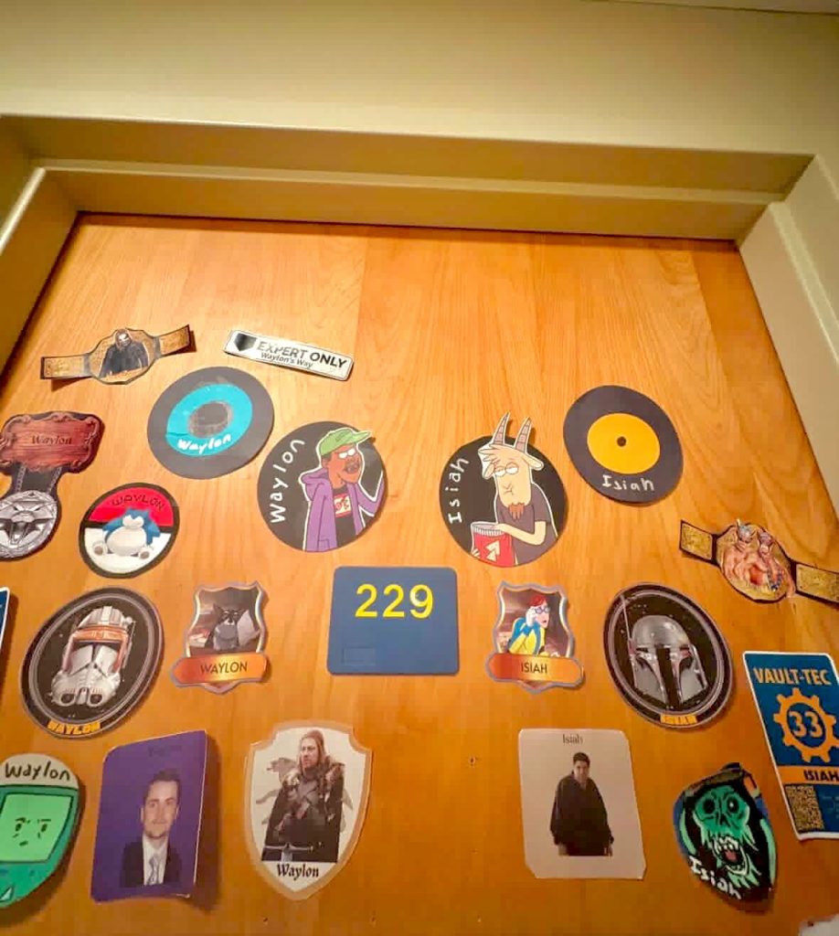 Dorm door of roommates Waylon and Isiah. DIY decals decorate the door.
